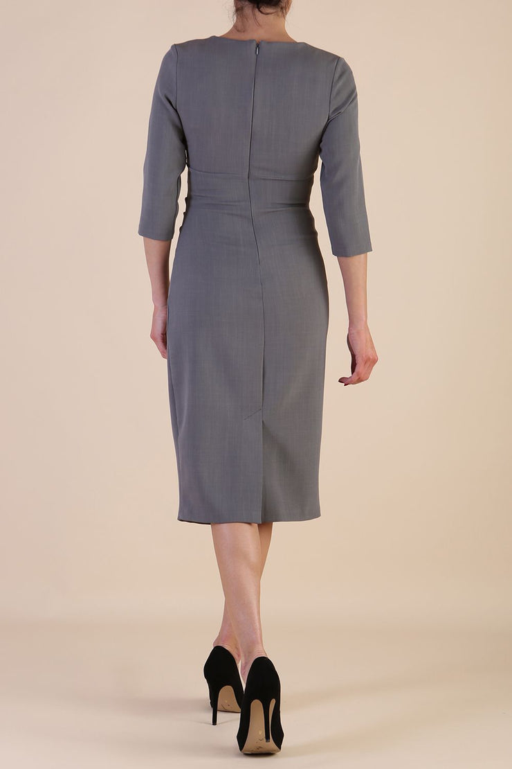 model is wearing the Diva Catwalk Ubrique pencil dress with Long sleeves and keyhole detail in Castlerock Grey fabric colour