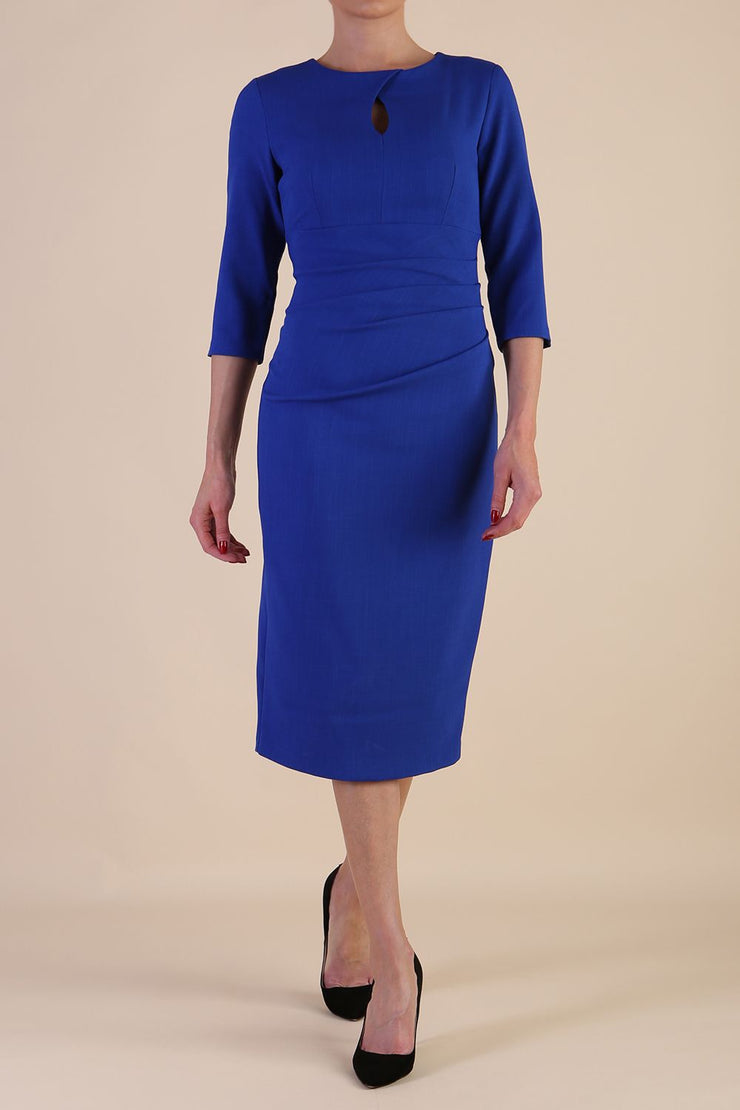 model is wearing the Diva Catwalk Ubrique pencil dress with Long sleeves and keyhole detail in Cobalt Blue fabric colour
