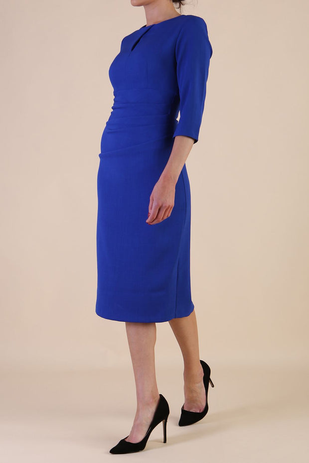 model is wearing the Diva Catwalk Ubrique pencil dress with Long sleeves and keyhole detail in Cobalt Blue fabric colour