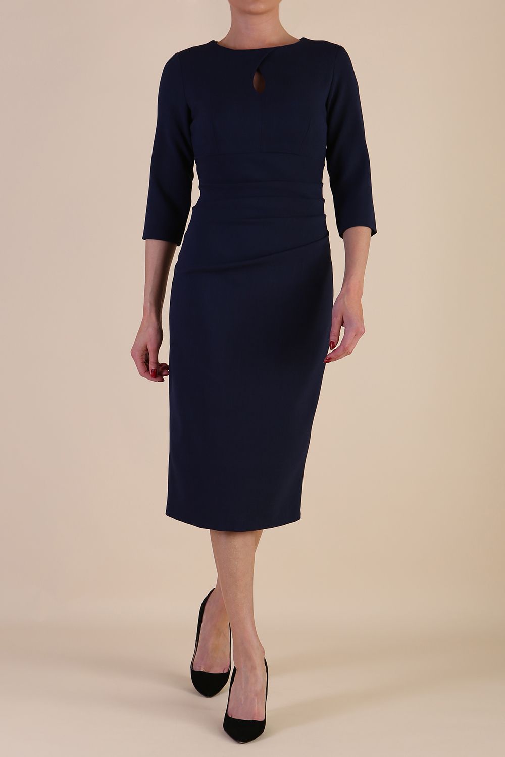 model is wearing the Diva Catwalk Ubrique pencil dress with Long sleeves and keyhole detail in Navy Blue fabric colour