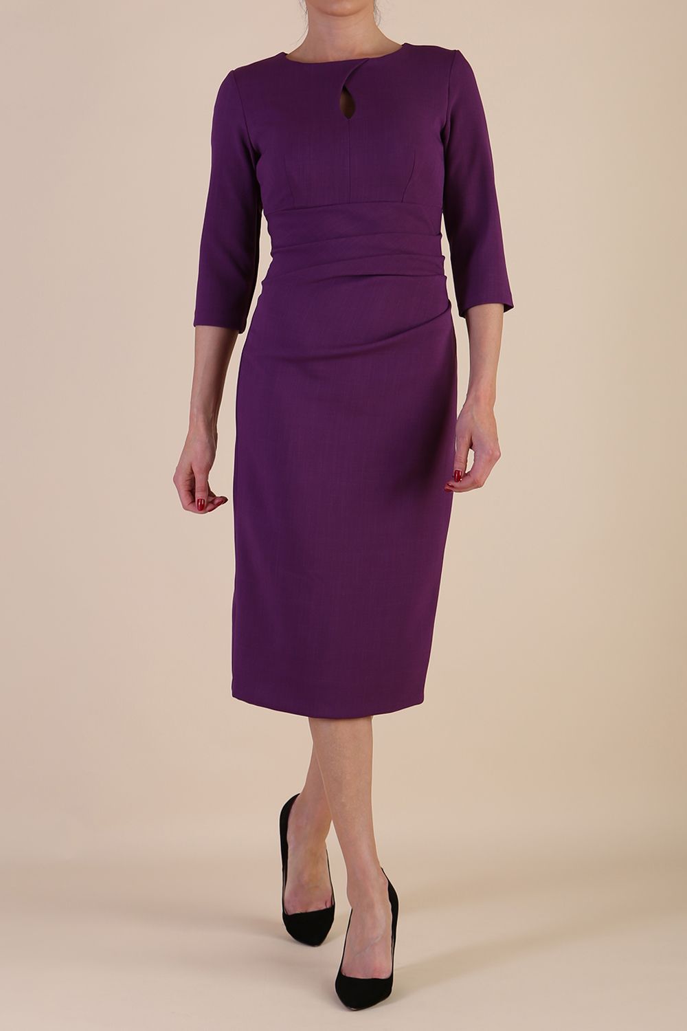 model is wearing the Diva Catwalk Ubrique pencil dress with Long sleeves and keyhole detail in Imperial Purple fabric colour