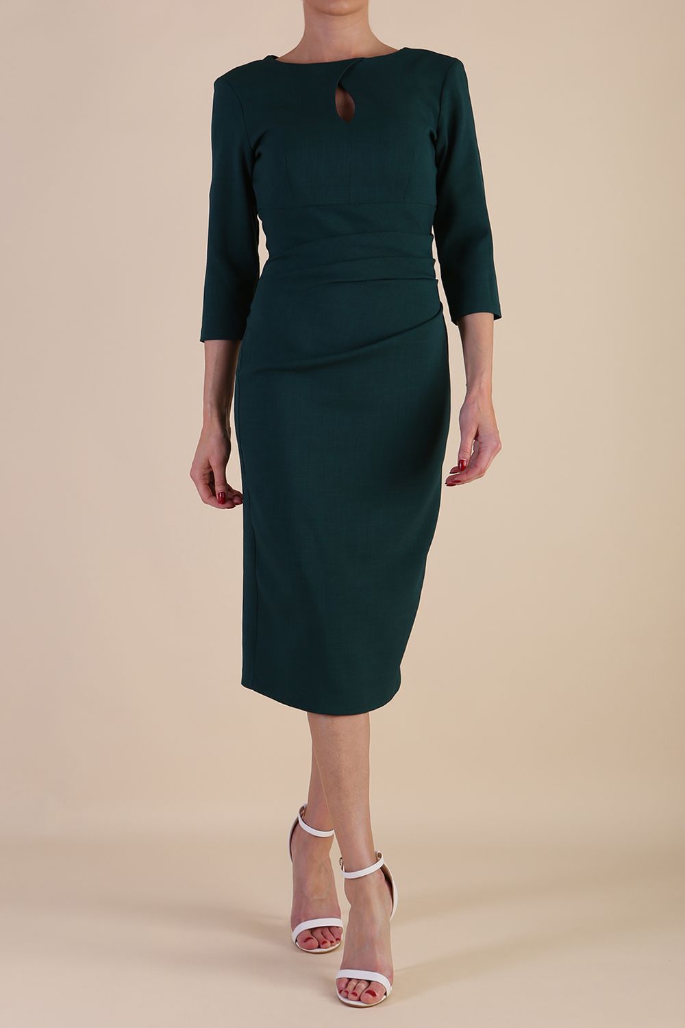 model is wearing the Diva Catwalk Ubrique pencil dress with Long sleeves and keyhole detail in Forest Green fabric colour