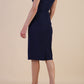 brunette model wearing diva catwalk lydia sleeveless pencil flattering fitted plain dress with split neckline and pleating across the body navy blue front