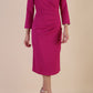 model is wearing diva catwalk miracle pencil dress with keyhole detail on a side of the front panel and gathering detail on a side or bodice panel with sleeves in magenta haze colour front