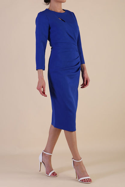 model is wearing diva catwalk miracle pencil dress with keyhole detail on a side of the front panel and gathering detail on a side or bodice panel with sleeves in cobalt blue colour front