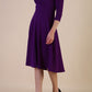 model is wearing diva catwalk january sleeved a-line v-neck dress in deep purple front