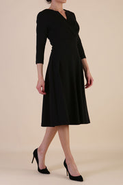 model is wearing diva catwalk january sleeved a-line v-neck dress in black front