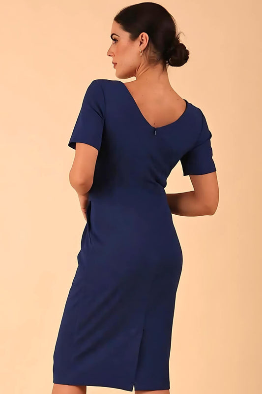 Brunette model is wearing marcel stretch short sleeve pencil dress image in midnight blue colour