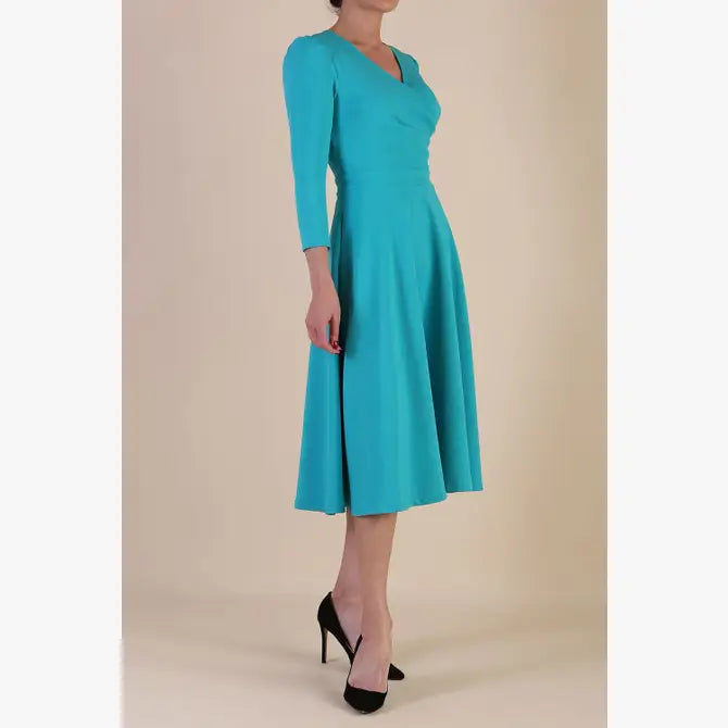 Model wearing diva catwalk Kate 3/4 Length Sleeve A-Line Swing Dress in Spectrum Indigo with pockets side