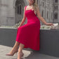 woman wearing a diva catwalk Tamsin Square Neckline Swing Dress sleeveless style with a midaxi  length and side pockets in Scarlet Red colour in Budapest