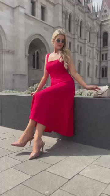 woman wearing a diva catwalk Tamsin Square Neckline Swing Dress sleeveless style with a midaxi  length and side pockets in Scarlet Red colour in Budapest