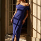 model wearing diva catwalk vegas calf length spectrum indigo midaxi dress with wide bardot neckline and open shoulders with a large opening at the front of the skirt with pleating coming down long skirt front (Spectrum Indigo)