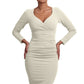 Model wearing the Diva Cynthia Pencil dress with pleating across the front in ivory cream front image