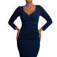 Model wearing the Diva Cynthia Pencil dress with pleating across the front in navy front image