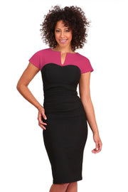 Model wearing the Diva Bryony Contrast dress with contrasting top and exposed zip at the back in black and rose pink front image