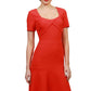 model is wearing diva catwalk madison a-line dress with square neckline and short sleeve in fiesta orange front