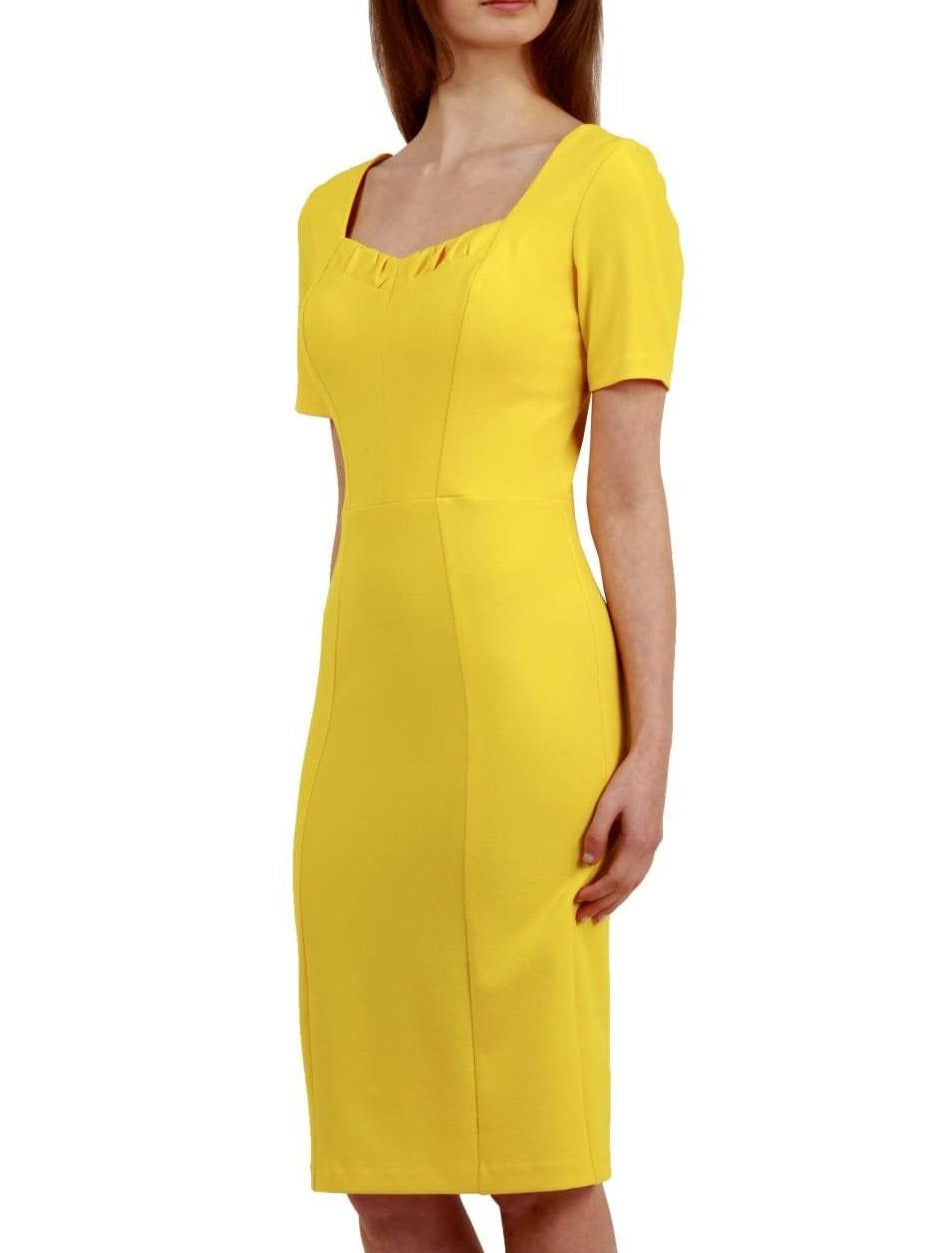model wearing diva catwalk mitzi short sleeve pencil dress with square frilled neckline in freesia yellow front 