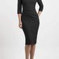 brunette model wearing seed diva catwalk milton sleeved pencil dress with a rounded neckline with a split in the middle in black front