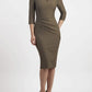 brunette model wearing seed diva catwalk milton sleeved pencil dress with a rounded neckline with a split in the middle in taupe brown front