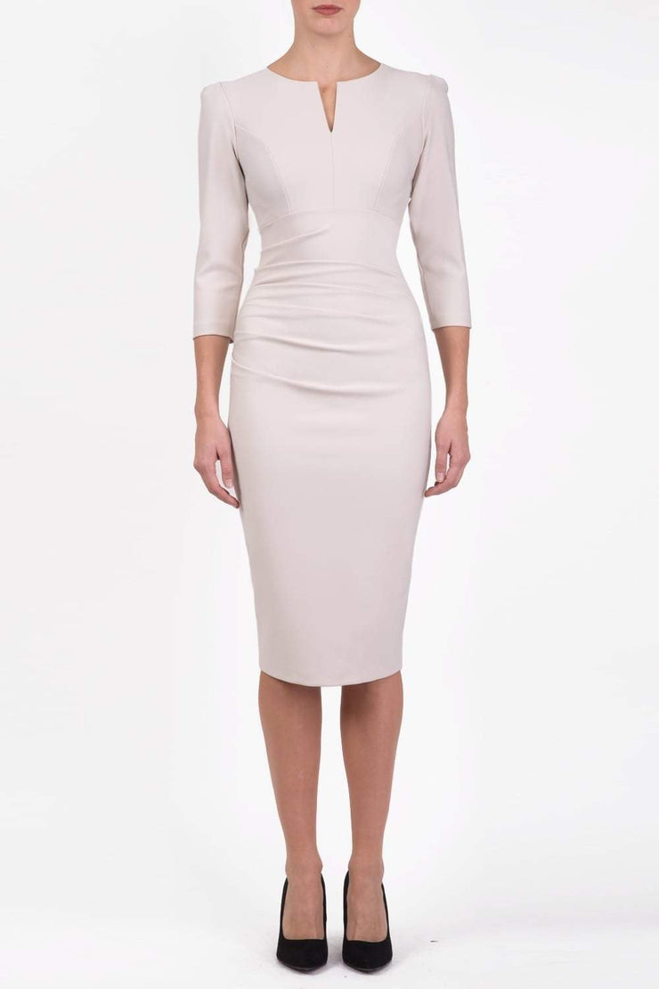 model is wearing diva catwalk seed fitzrovia sleeved pencil dress in sandy cream front