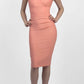 brunette model wearing diva catwalk beyonce pencil fitted dress with high neckline without sleeves with a wide band and pleating across the tummy area with a crossed detail neckline in colour peach front