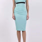 brunette model wearing diva catwalk nadia sleeveless pencil dress in mint green colour with a contrasting black band and exposed zip at the back with a rounded neckline with a slit  in the middle front