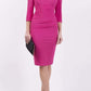 Model wearing the Diva Astra pencil dress with off shoulder design in ottoman fushia pink front image 