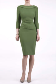 model wearing diva catwalk york pencil-skirt dress with sleeves and rounded folded collar and plearing across the tummy area in vineyard green colour front