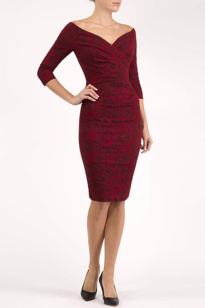 Model wearing the Diva Catherine Jacquard dress with overlapping bodice in circle red front image