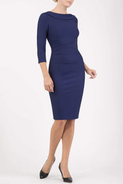 model wearing diva catwalk york pencil-skirt dress with sleeves and rounded folded collar and plearing