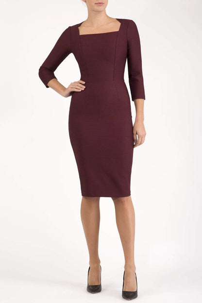 model is wearing seed rowena pencil dress with sleeves and square neckline in port royale front