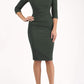 Model wearing the Diva Atlantis Pencil dress with three quarter length sleeves in deep green and black front image