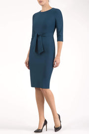 Model wearing the Diva Amatis Pencil dress with round neckline, inserted tie detailing at the front in glorious teal front image