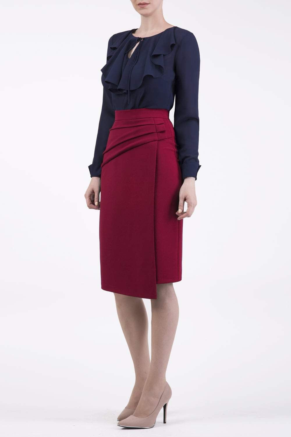 model is wearing diva catwalk antibe pencil asymmetric skirt with pleating at the front in red front