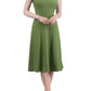 model wearing diva catwalk rochelle swing skirt a line dress without sleeves with a low v neck in green front