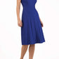 model wearing diva catwalk rochelle swing skirt a line dress without sleeves with a low v neck in cobalt front