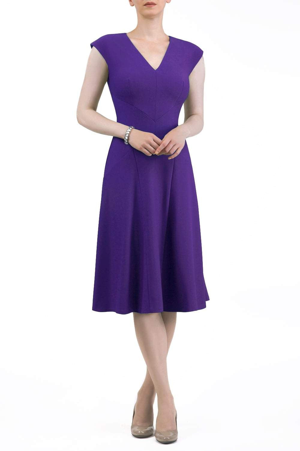 model wearing diva catwalk rochelle swing skirt a line dress without sleeves with a low v neck in purple front