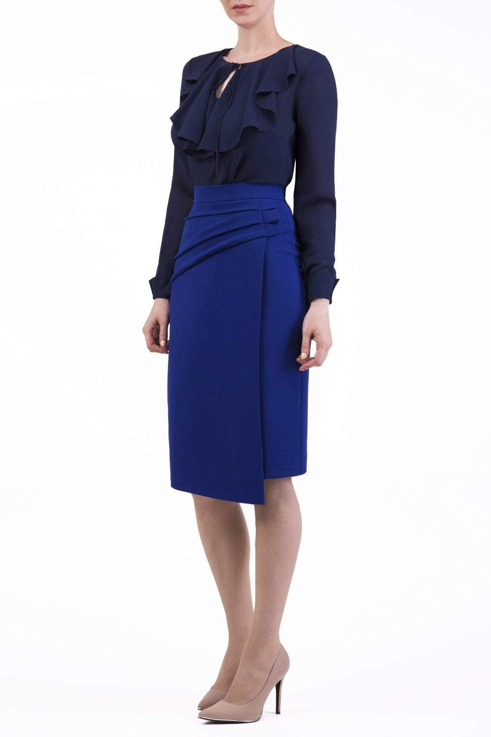 model is wearing diva catwalk antibe pencil asymmetric skirt with pleating at the front in blue front