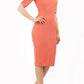 model is wearing diva catwalk solway pencil dress cold shoulder detail and rounded neckline in sea coral front