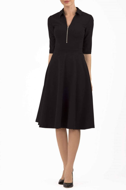 Model wearing the Diva Annette Swing Dress with V shaped neckline with zip detail in black front image