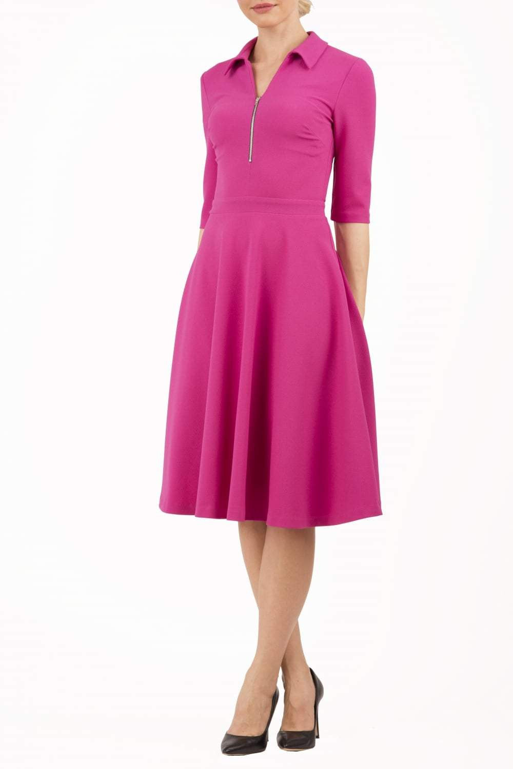 Model wearing the Diva Annette Swing Dress with V shaped neckline with zip detail in fuschia pink front image