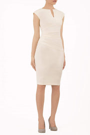 brunette model wearing diva catwalk lydia sleeveless pencil flattering fitted plain dress with split neckline and pleating across the body ivory vanilla cream front