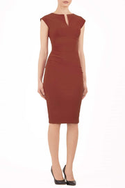 brunette model wearing diva catwalk lydia sleeveless pencil flattering fitted plain dress with split neckline and pleating across the body terracotta brown front