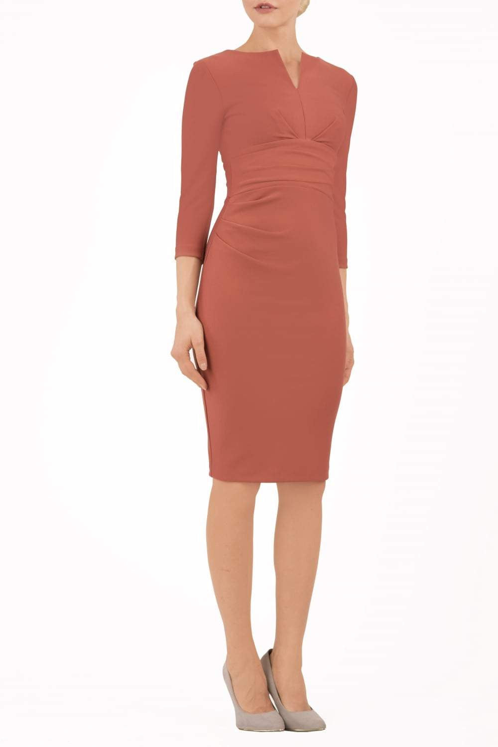 model wearing diva catwalk donna pencil dress in marsala brown colour with wide band and sleeves and rounded neckline with low split in front
