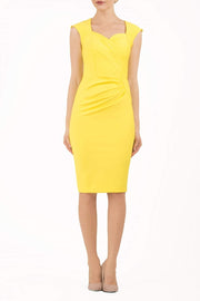 blonde model is wearing diva catwalk vivian sleeveless pencil skirt dress with overlapped bust area and lowered neckline in blazing yellow colour front