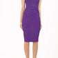 blonde model is wearing diva catwalk vivian sleeveless pencil skirt dress with overlapped bust area and lowered neckline in royal purple colour front