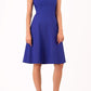 Brunette Model is wearing a sleeveless swing high neck dress in palace blue by Diva Catwalk front