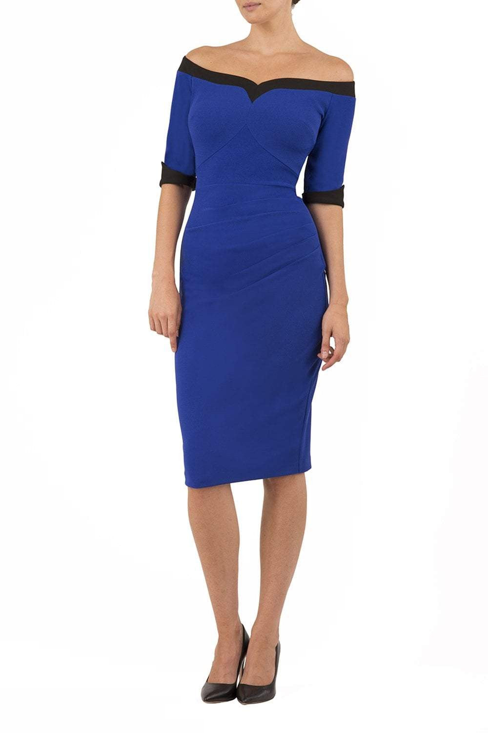 blonde model is wearing diva catwalk fellini sweetheart neckline fitted pencil dress with sleeves with cuff in colour royal blue with black contrasting detail front