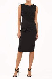 Model wearing the Diva Demelza Lace Pencil dress with lace stretch detailing and round neckline in black front image