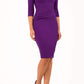 model is wearing diva catwalk quatro sleeved pencil dress with asymmetric wide cut our neckline in purple front